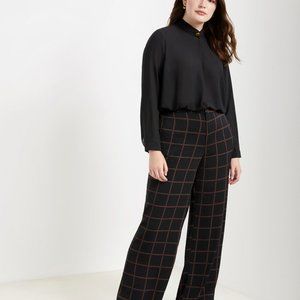 Black blouse with gold button at neck